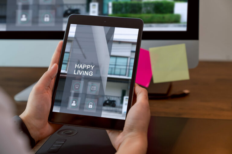 A person holding a tablet interacting with their apartment community digitally to pay rent, schedule amenities, and more.
