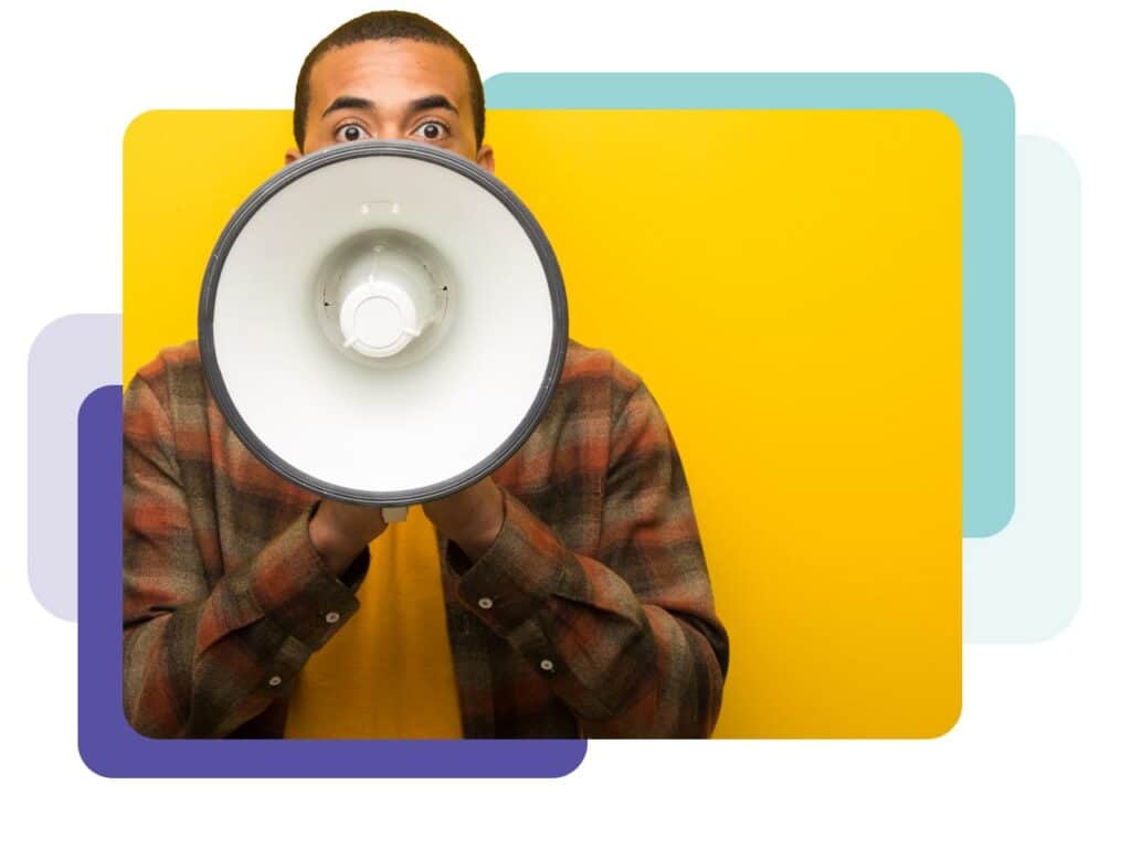 Young man talking into a megaphone