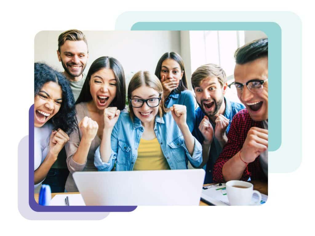 Marketing team gathered around a laptop looking at exciting news